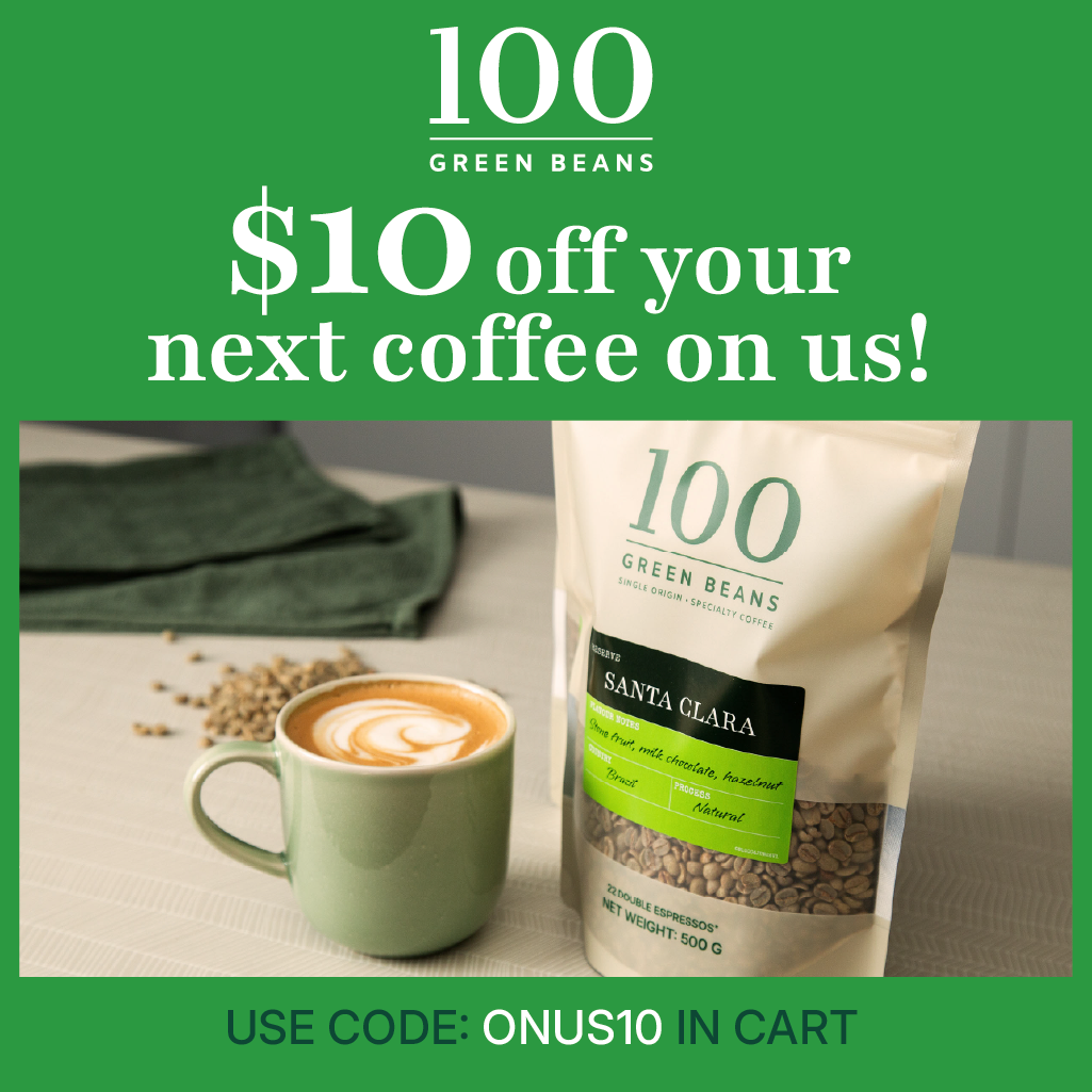 Promotional graphic for 100 Green Beans offering $10 off the next coffee on us! The image features a bag of Santa Clara whole bean coffee next to a green mug with latte art, with a green background and text overlays.